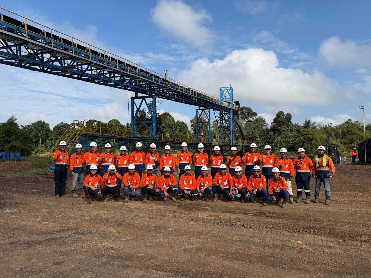 Team under an elevated conveyor